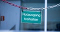 Green emergency exit plate, Ã¢â¬ÅNotausgang freihaltenÃ¢â¬Â, german Royalty Free Stock Photo